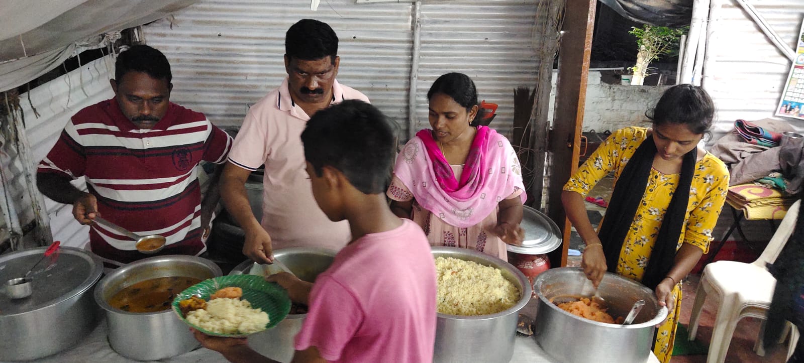 Community meal service with volunteers and children
